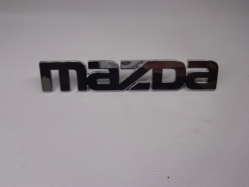 Mazda Emblem for Passenger Side Rear Finish Panel Factory New 1990-1997 NA Mazda Miata