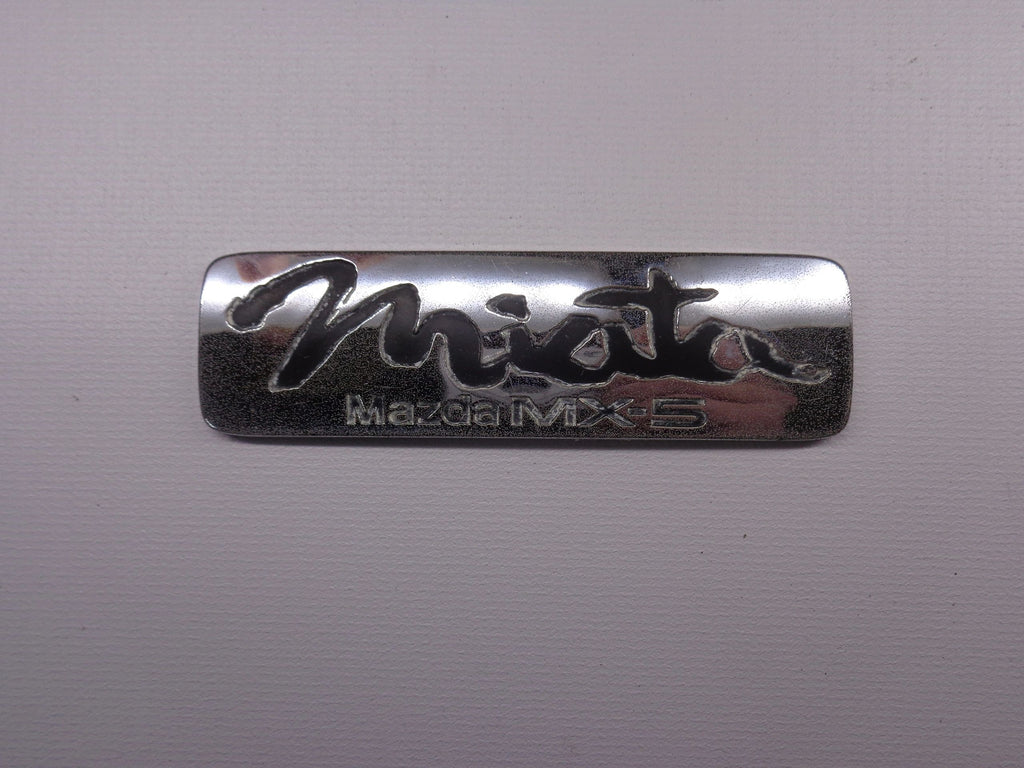 Miata Emblem for Driver Side Rear Finish Panel Factory Used 1990-1997 NA Mazda Miata